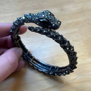 Black snake bracelet with faux diamonds throughout
